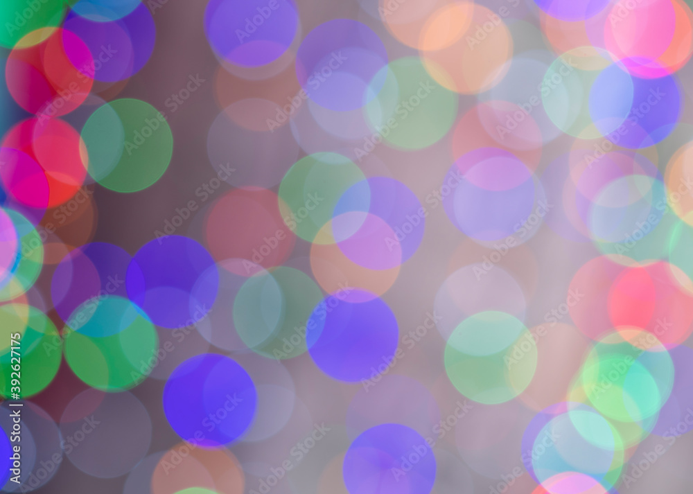 beautiful colored bokeh festive background consisting of multicolored lights out of focus on dark background