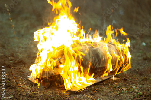 Bright hot red flames and gray smoke from burning construction debris Gorenje