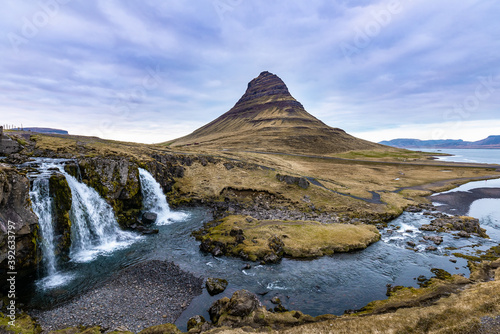 Scenic image of Iceland. Incredible Nature scenery during sunset. Great view on famous Kirkjufell Mountain with colorful, dramatic sky. popular place for photographers. Best famous travel locations