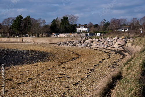 Coastal path along by Farlington marshes, Portsmouth, UK on a sunny winter's day. photo