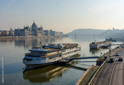 Morning beautiful Budapest in all its glory. Ship on the river in the background of the Parliament. Urban landscape