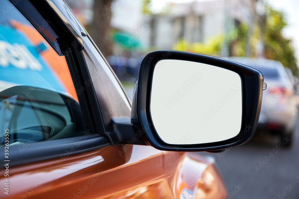 car side mirror window with soft-focus and over light in the background
