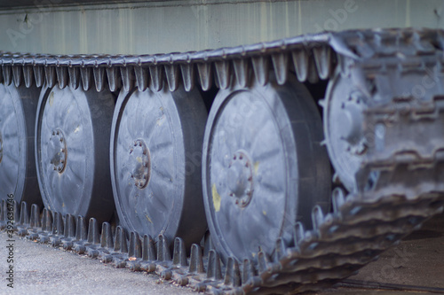 Close-up of wheels and tracks of a tank