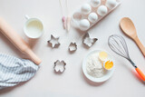 Cook cookies. Tools and ingredients for making sweet pastries or cupcakes. Cooking, flour, eggs, bakeware on a white background. Cooking Ingredients. Cooking gingerbread. Culinary textiles, baked 