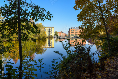 City park Åbackarna and the gistoric industrial landscape along Motala river in Norrköping during fall in Sweden.