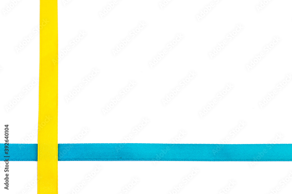 Gold and blue silk ribbon isolated on white background. Decorative element for design. Festive decor concept. Gold and blue silk ribbon isolated on white background. Decorative element for design. Festive decor concept.