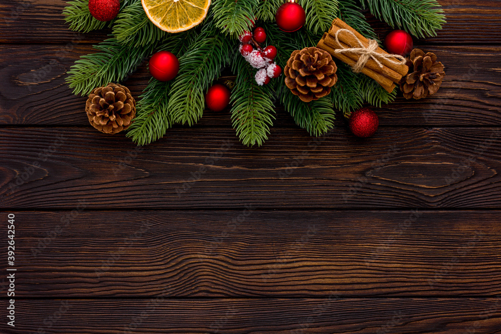 Spruce branch, cones and toys decoration on christmas or new year on dark wooden background. Spruce branch, cones and toys decoration on christmas or new year on dark wooden background.