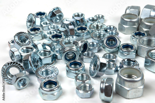 a large number of various industrial fasteners close-up photo
