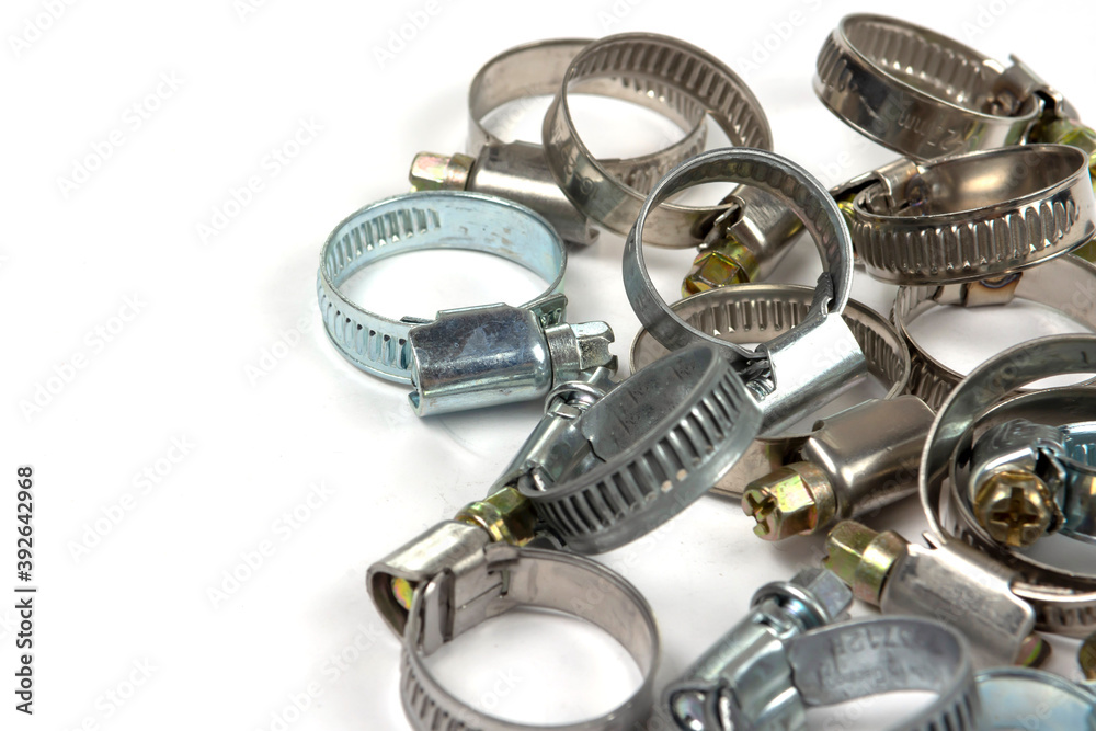 metal clamps on a white background to secure various products metal clamps on a white background to secure various products