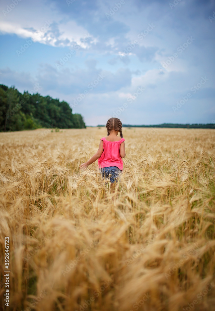 Girl running in wheat field, live life to the fullest, freedom, childhood and happiness Girl running in wheat field, live life to the fullest, freedom, childhood and happiness