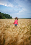 Girl running in wheat field, live life to the fullest, freedom, childhood and happiness