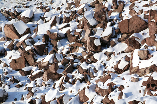 stones covered snow