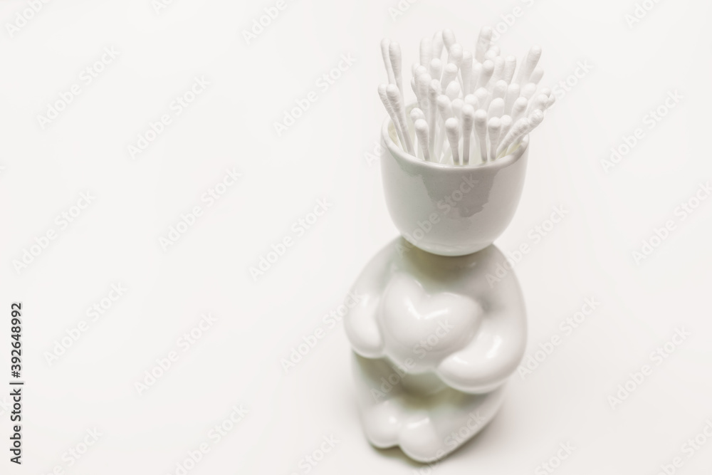 capacity for cotton sticks on white background