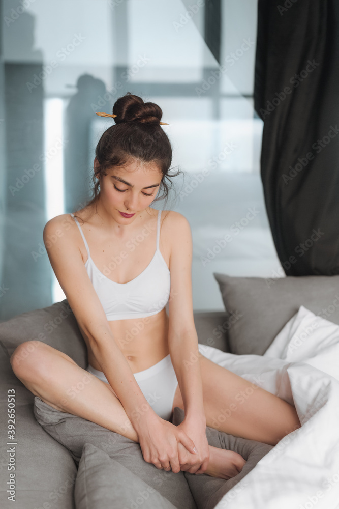 Flirty sexy girl with a white blanket in her bedroom. Good morning Flirty sexy girl with a white blanket in her bedroom. Good morning