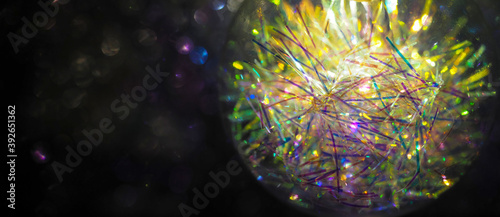 Panoramic festive decoration, Christmas and New Year light. Decoration lamp in dark, light bulb decor, copy space. Garlands of burning light in bulb at night