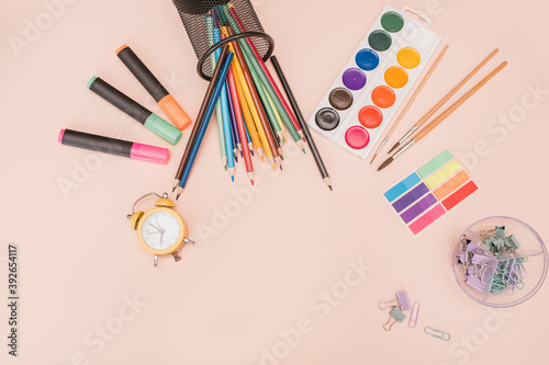 Wallpaper Mural Stationery school supplies on a pink background. The workplace of the artist. art therapy. creativity, drawing. Online training, trainings, courses, e-learning, distance learning, home learning. Torontodigital.ca