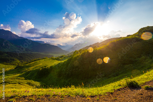 Beautiful mountain landscape at Caucasus mountains with clouds and blue sky