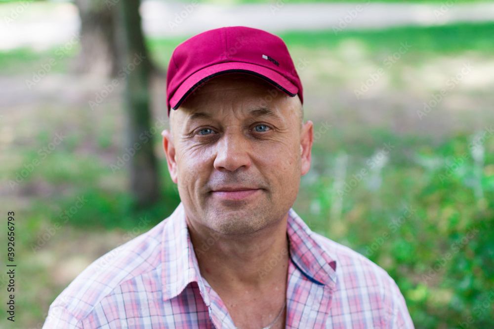 portrait of a middle aged man wearing a cap portrait of a middle aged man wearing a cap