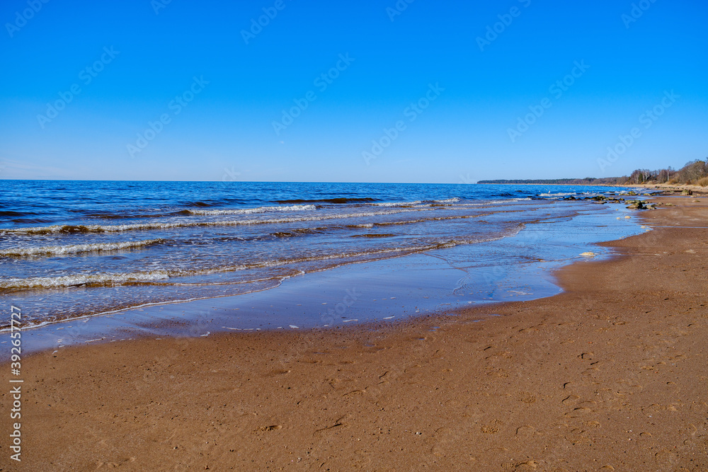 sea shore in summer beach with blue water waves and sand
