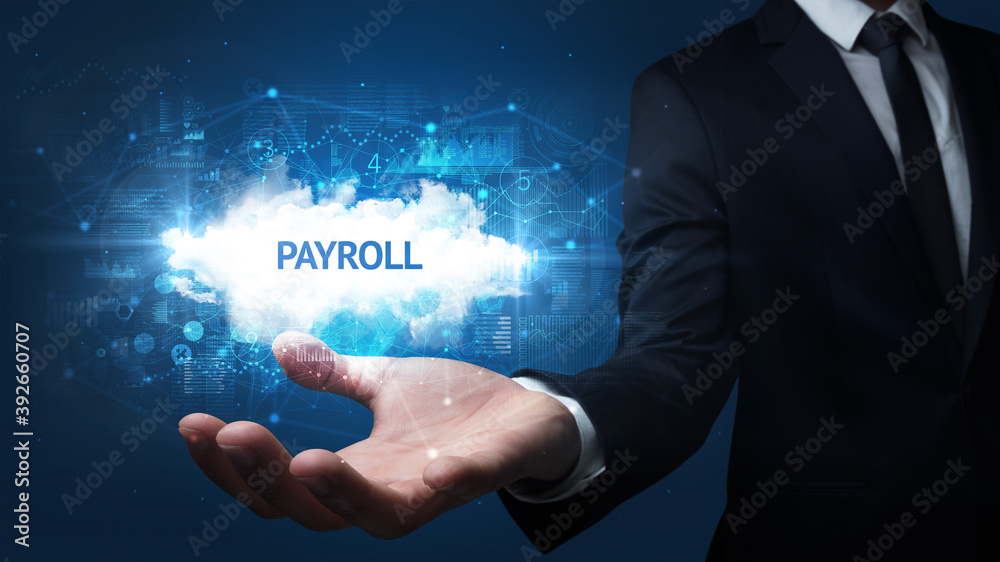 Hand of Businessman holding PAYROLL inscription, successful business concept Hand of Businessman holding PAYROLL inscription, successful business concept