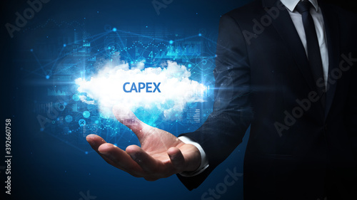 Wallpaper Mural Hand of Businessman holding CAPEX inscription, successful business concept Torontodigital.ca