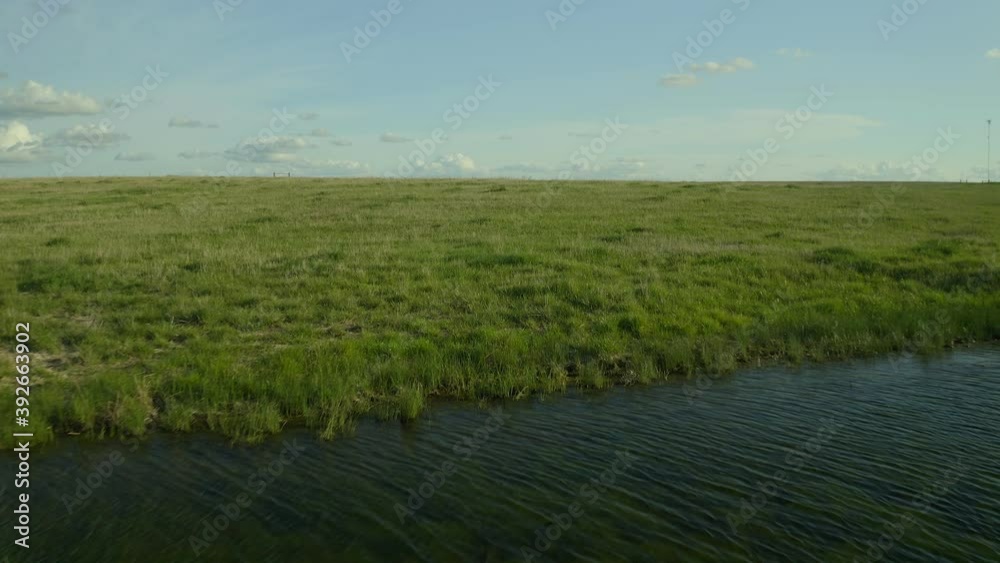 Traveling over a small pond near the Great Plains. Traveling over a small pond near the Great Plains.