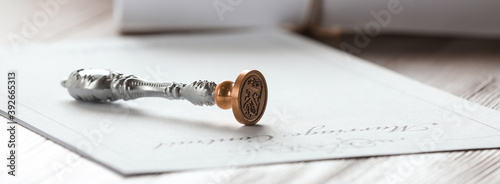 Vintage notary stamp and document on wooden table, closeup. Banner design