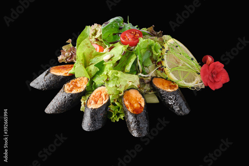 Tataki salad with mixed greens, salmon, cucumber, avocado, cherry tomato, soy sprouts, narsharab sauce, lemon, microgreen isolated on black photo