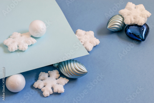 Christmas aqua blue background with decorative baubles, balls and snowflakes.
