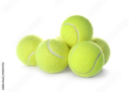 Valokuva Heap of tennis balls on white background. Sports equipment