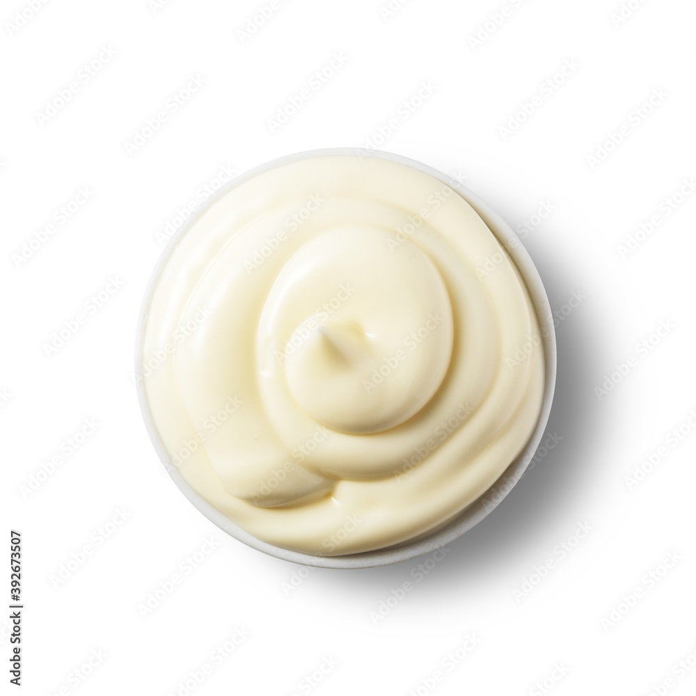 Fresh mayonnaise in a bowl on a white isolated background. Top view. Fresh mayonnaise in a bowl on a white isolated background. Top view.