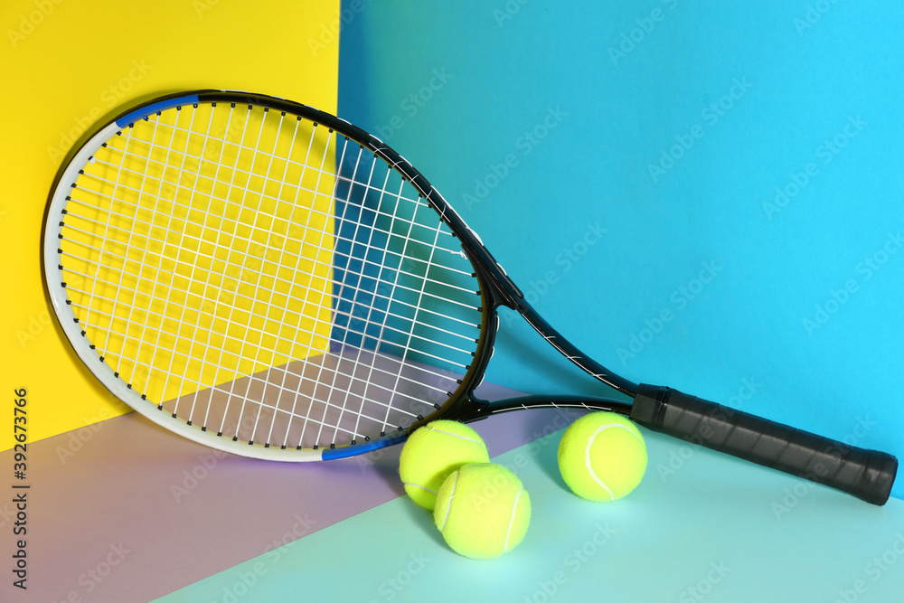 Tennis racket and balls on color background. Sports equipment