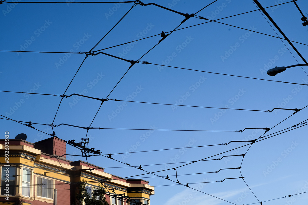 Traditional cable car infrastructure against a clear blue summer sky at sunset in San Francisco, California Traditional cable car infrastructure against a clear blue summer sky at sunset in San Francisco, California