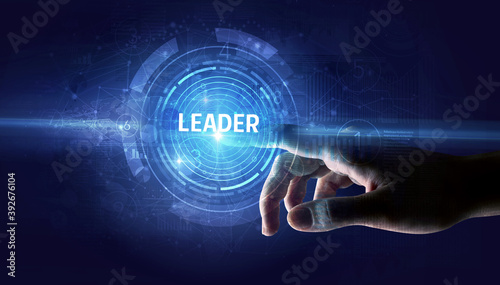 Hand touching LEADER button, modern business technology concept