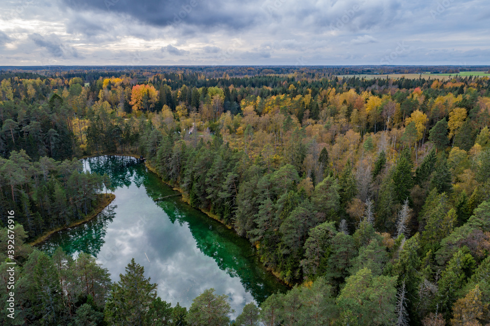 Sunset at blue lake. Beautiful autumn aerial view.