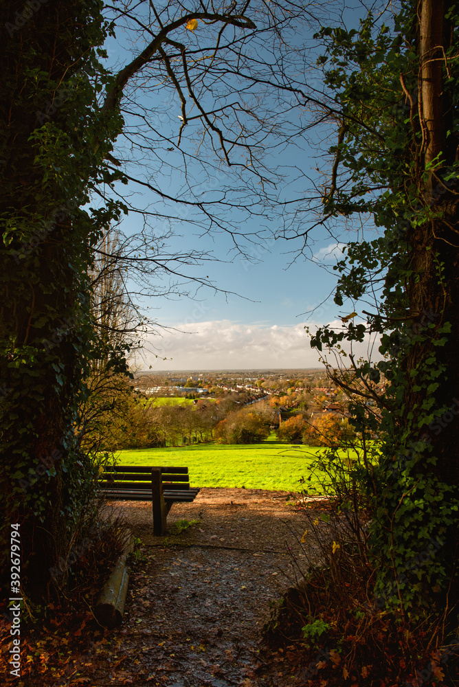 Bench in Harow's Church Fields with a view on North Harrow 