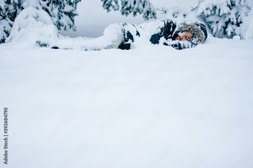 Lonely man sleeping in the snow