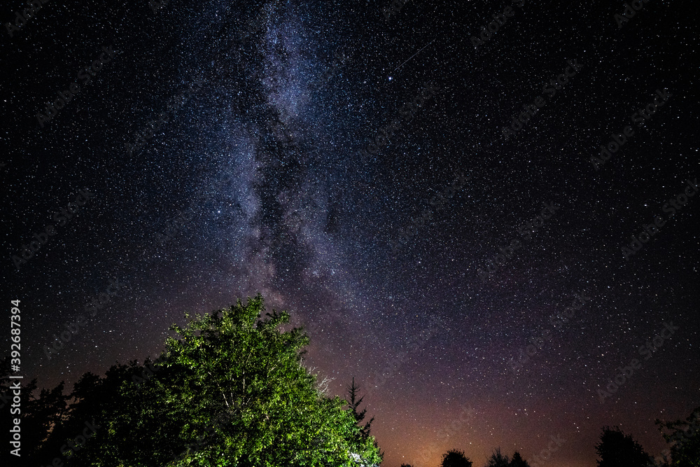 Overhead milky way with stars in clear summer night.
Country side. Overhead milky way with stars in clear summer night.
Country side.