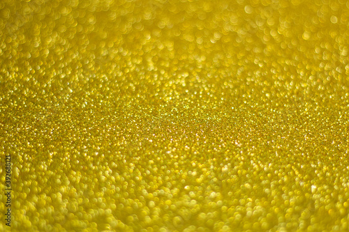 Universal celebration background, perfect for Christmas or New Year, yellow glitter, selective focus