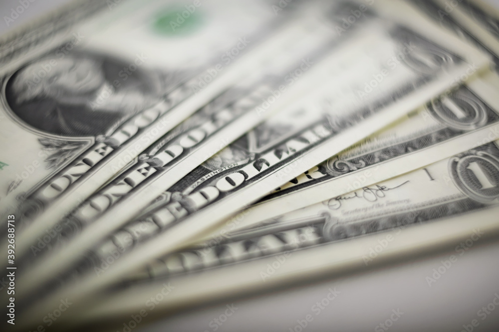 Blurry background with one-dollar bills. Blurry background with one-dollar bills.