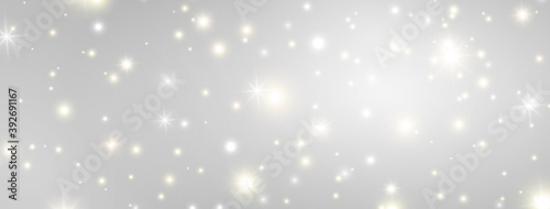 Glitter lights effect long banner. Magic dust particles. Christmas design. Bright golden and white sparkles on grey background. Shining stars composition. Sun flash. Vector illustration