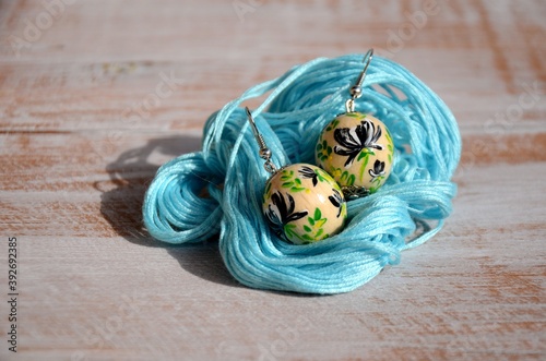 Handpainted wooden ball earrings with floral pattern