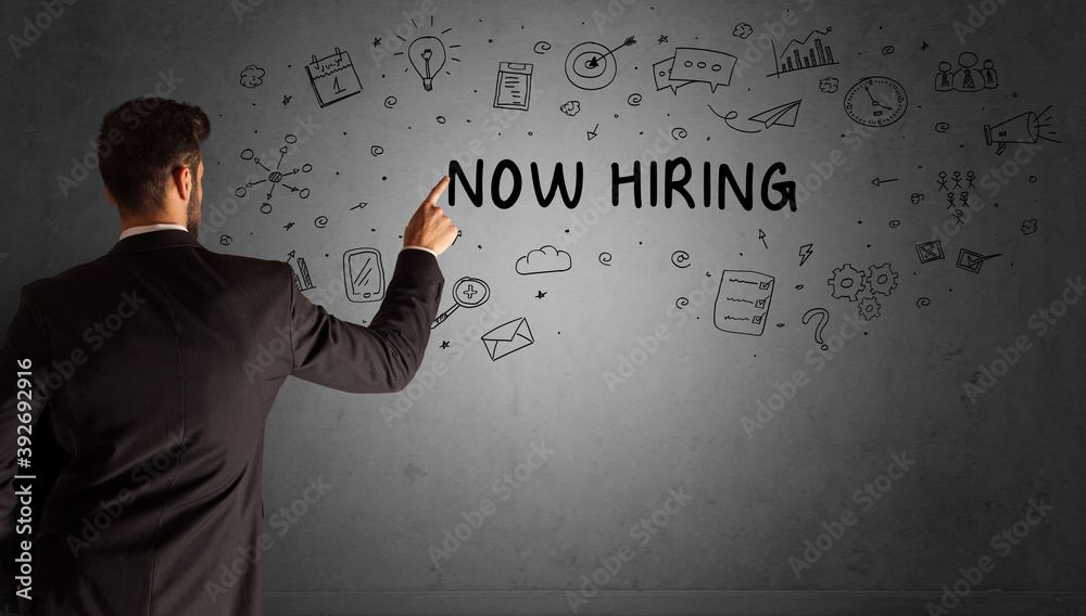 businessman drawing a creative idea sketch with NOW HIRING inscription, business strategy concept businessman drawing a creative idea sketch with NOW HIRING inscription, business strategy concept