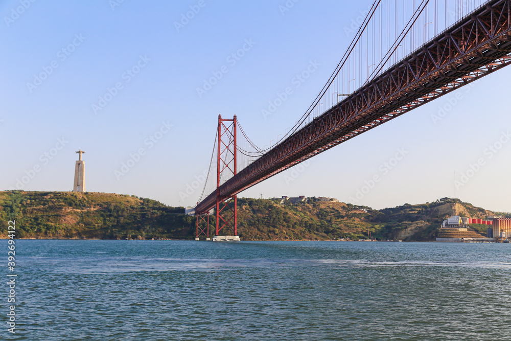 Naklejka premium 25 April Bridge over the Tagus River connecting the cities of Lisbon and Almada, in Portugal