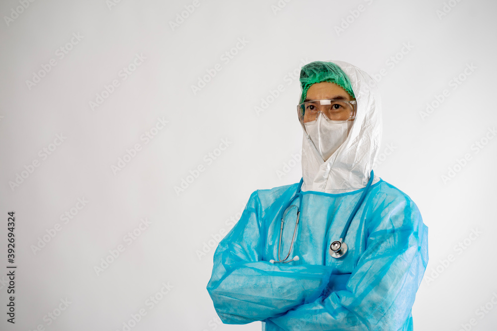 portrait of Asian medical doctor in protective suit, glasses and surgical mask with virus pandemic vaccine standing on white background copy space isolated. portrait of Asian medical doctor in protective suit, glasses and surgical mask with virus pandemic vaccine standing on white background copy space isolated.