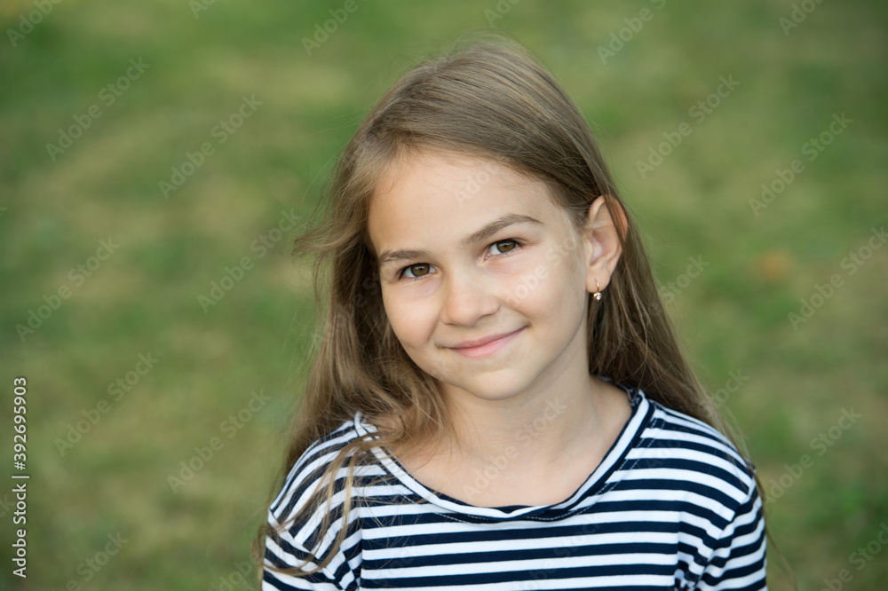 Nurturing future. Happy child smile natural background. Little girl child wear long hair style. Beauty salon. Childcare and childhood. International childrens day. November 20