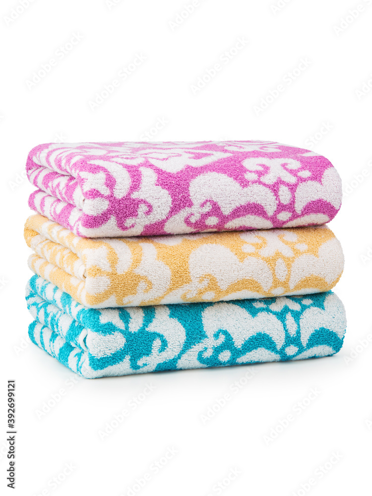 multi-colored Terry cotton bath towels, isolate on a white background multi-colored Terry cotton bath towels, isolate on a white background