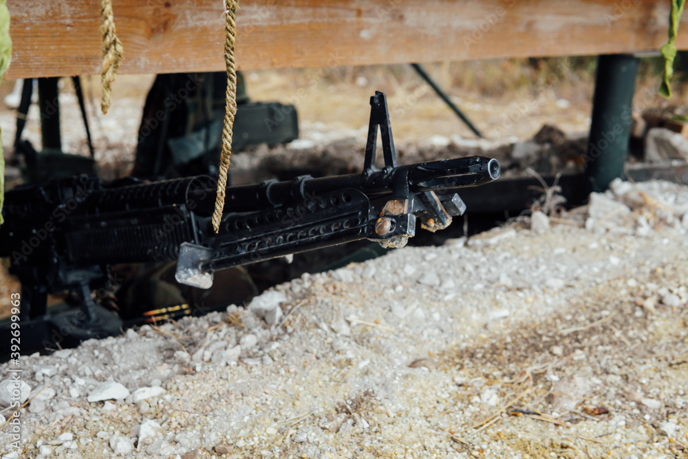 gun barrel in hiding for shooting in war gun barrel in hiding for shooting in war