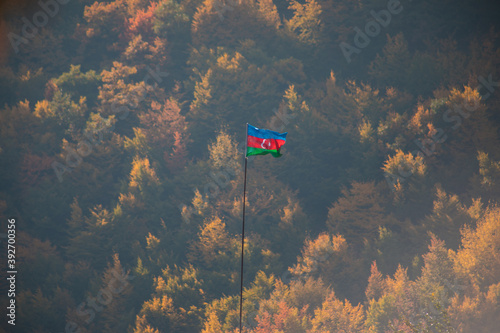 Fototapeta Naklejka Na Ścianę i Meble -  Azerbaijan flag,Waving flag on the mountain. National flag of Azerbaijan on strong wind in the sunny day