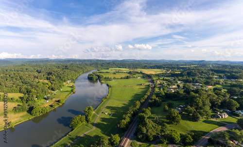 Tablou pe pânză Aerial view of river winding through the countryside